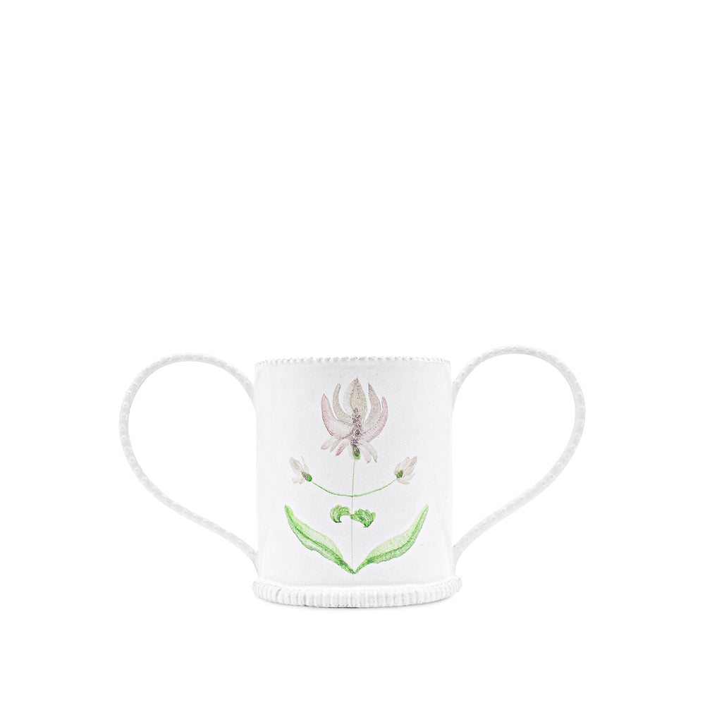 White ceramic vase with floral design on a white background